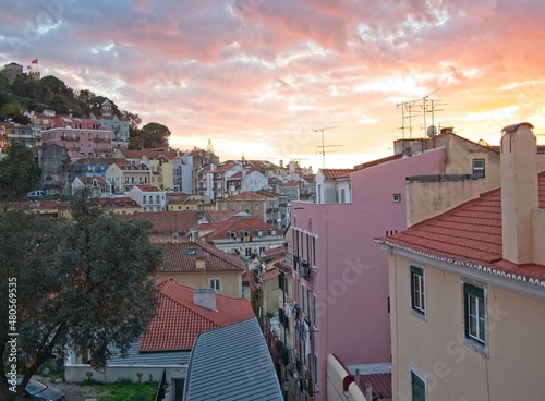 Sunset with clouds over the Mouraria district of Lisbon, Portugal photo