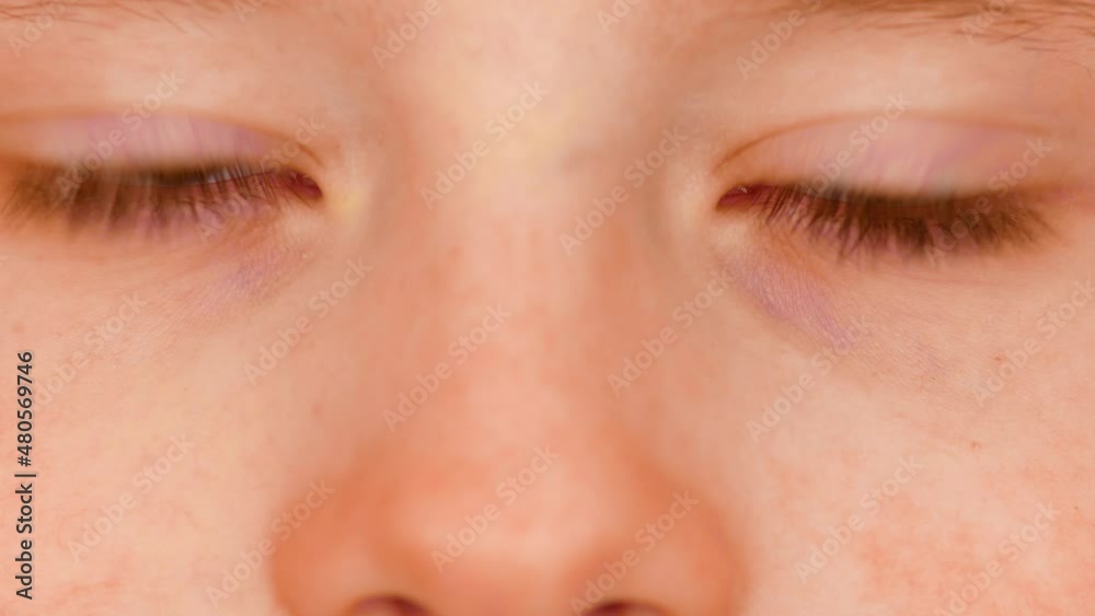 Close-up of the eyes of a brown caucasian boy 7 years old looking at the camera.Macro. The look of a sincere child. Childhood theme. Parts of the face of a child's eyes extreme close-up. Close-up of the eyes of a brown caucasian boy 7 years old looking at the camera.Macro. The look of a sincere child. Childhood theme. Parts of the face of a child's eyes extreme close-up.