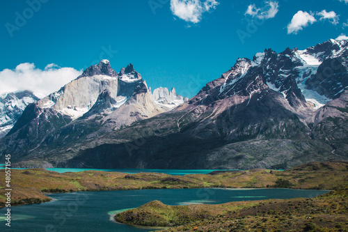 Snowy mountains with clouds on top in the Torres del Paine area of ​​Chilean Patagonia