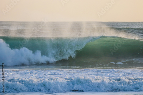 Fototapeta Naklejka Na Ścianę i Meble -  Perfect wave breaking in a beach. 