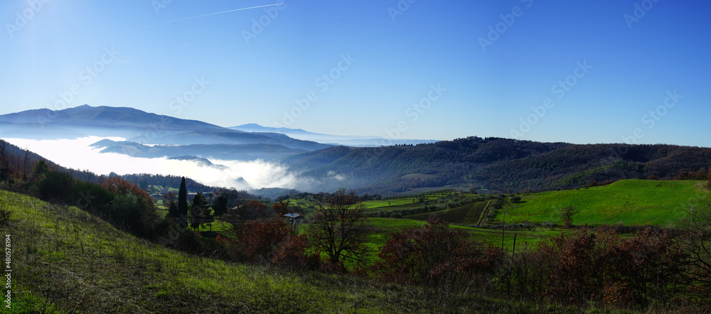 Umbria hills panoramic view in a foggy winter morning, Italy