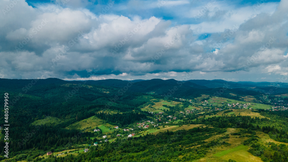 Naklejka premium mountains aerial view sky clouds