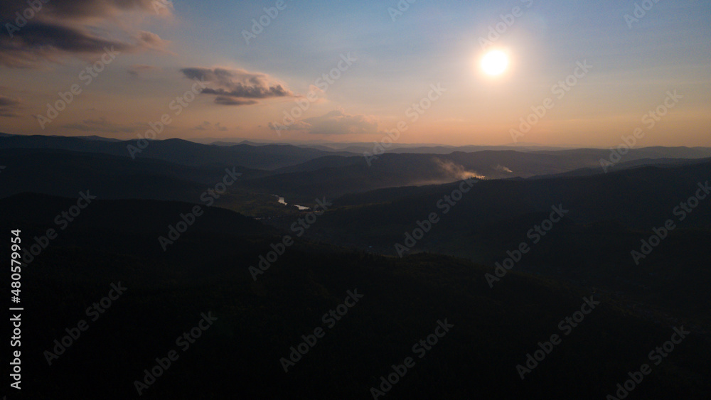 Fototapeta premium Mountains forest at sunset top view