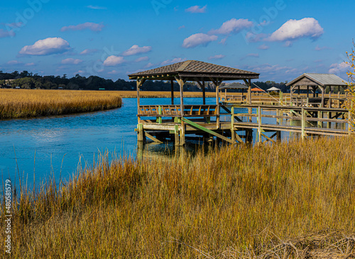 Wooden Dock on The Salt Marsh of The Waccamaw River, Pawleys Island, South Carolina, USA © Billy McDonald