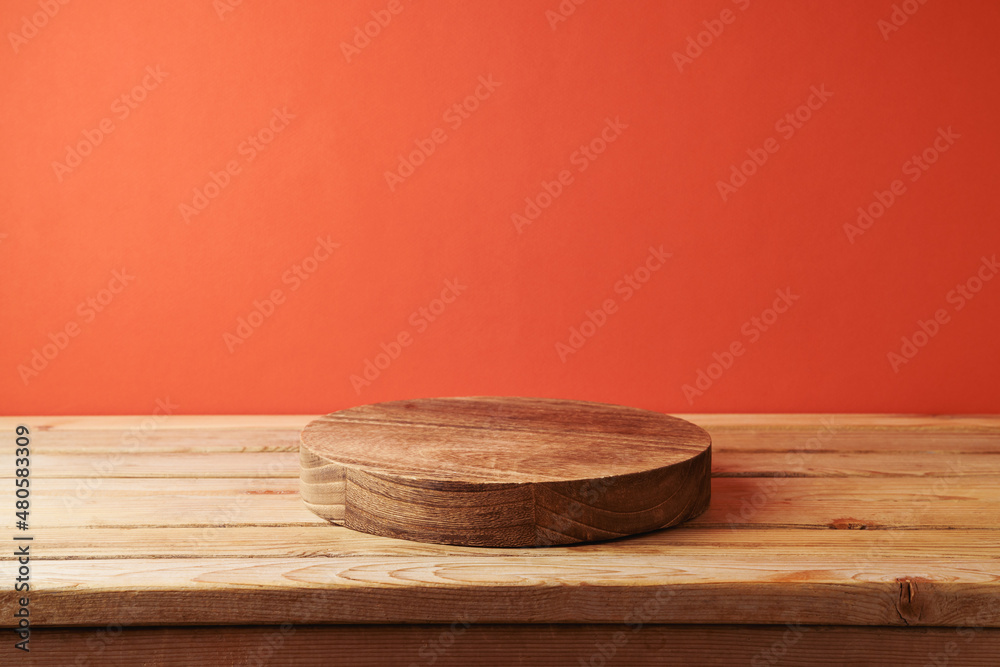 Empty wooden podium for cosmetic product display over red background. Valentines day mock up for design and presentation Empty wooden podium for cosmetic product display over red background. Valentines day mock up for design and presentation
