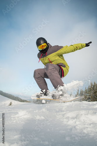 man snowboarder portrait carpathian mountains on background