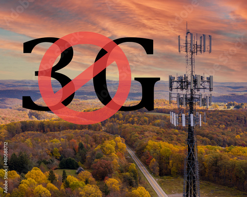 End of life for 3rd generation or 3G cell mobile networks illustrated with sign superimposed on rural cellphone tower