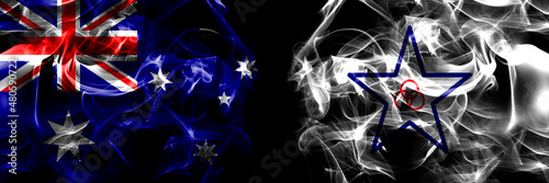 Flags of Australia, Australian vs Japan, Japanese, Engaru, Hokkaido, Okhotsk, Subprefecture. Smoke flag placed side by side on black background photo