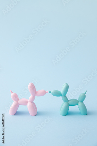 Balloon dogs in love on pastel blue background. Love card. Layout. Flat design. Minimal valentines mood concept. Valentine day inspiration. Flat lay. Pet minimal concept.