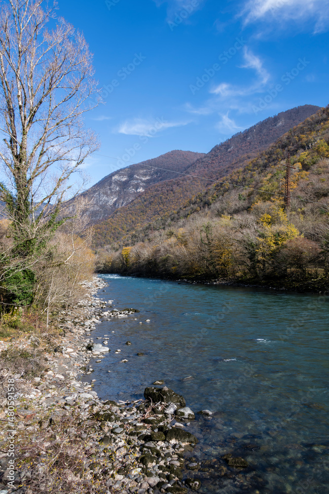 Landscape with a mountain river in late autumn. Bzyb river in the Caucasus mountains in Abkhazia.