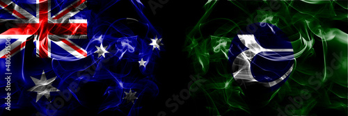 Flags of Australia, Australian vs Japan, Japanese, Tobetsu, Hokkaido, Ishikari, Subprefecture. Smoke flag placed side by side on black background photo