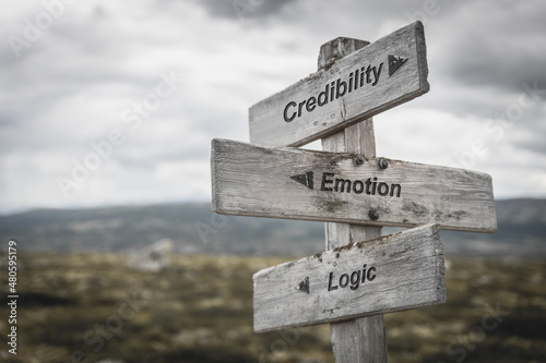 credibility emotion logic text on wooden sign outdoors. photo
