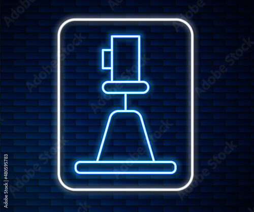 Glowing neon line Tacheometer, theodolite icon isolated on brick wall background. Geological survey, engineering equipment for measurement and research. Vector