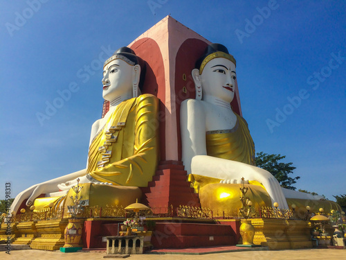 Four sided sitting buddha statue at.Kyaikpun Pagoda in Bago, Myanmar photo