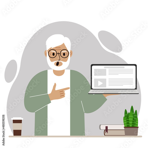 Screaming grandfather holding a laptop computer with one hand and pointing at it with the other. Laptop computer technology concept.