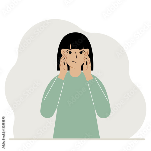 Unhappy woman clutching his head with his hands. Emotions and body language concept. Stress, tension and migraine concept.