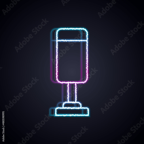 Glowing neon line Punching bag icon isolated on black background. Vector
