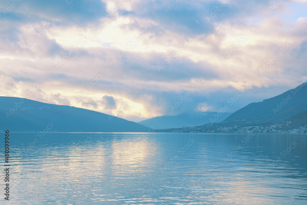 Cloudy misty day. Beautiful Mediterranean landscape. Montenegro, Adriatic Sea. Winter view of Kotor Bay