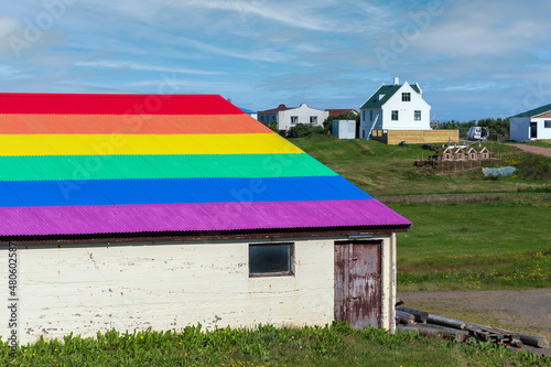 Barn with a rainbow roof supporting equal rights for LGBTQ people community. Westfjords, Iceland