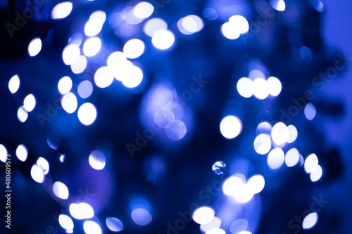 Bokeh blue on a black background. Blur and bokeh abstract , vibrant colors and textured. Good wallpapers .Copy space.
