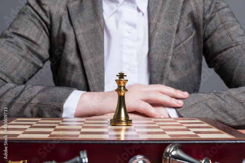 A man plays chess at the table.