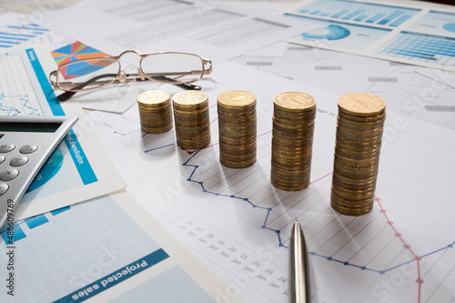 Money and business graphics on the desktop.


