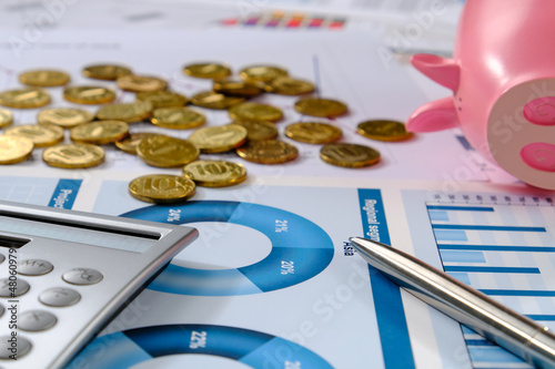 Money and business graphics on the desktop.


