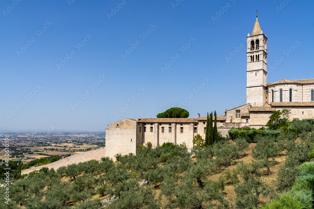 Panoramic view from Assisi with the bell tower of the Basilica of Santa Chiara, Umbria, Italy