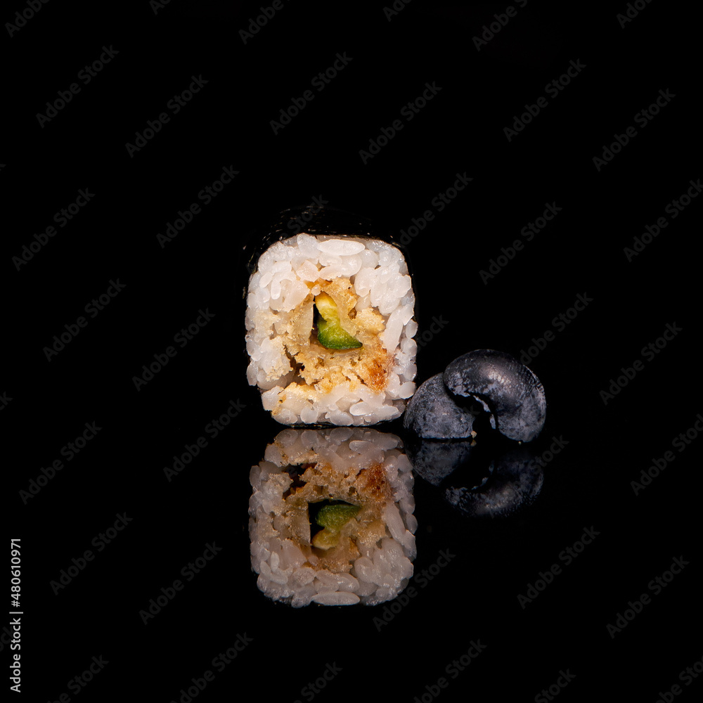 Uramaki Sushi Rolls with salmon on black background. Sushi menu. Japanese food. Uramaki Sushi Rolls with salmon on black background. Sushi menu. Japanese food.