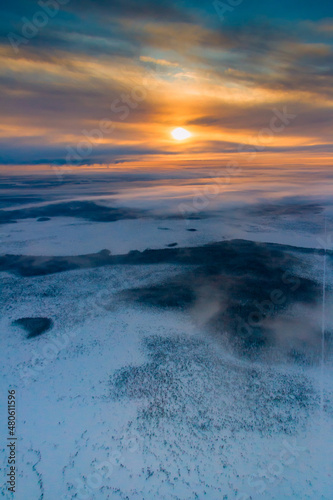 Aerial view of winter snowy countryside at sunrise