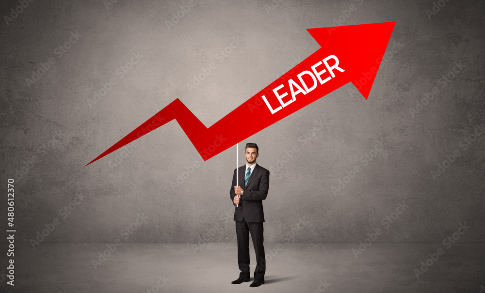 Fototapeta premium Young business person in casual holding road sign