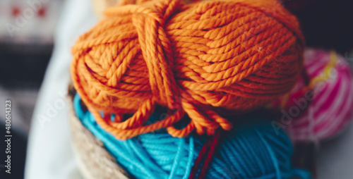 Fotografie Close up of orange and blue yarn ball to do knit work hobby