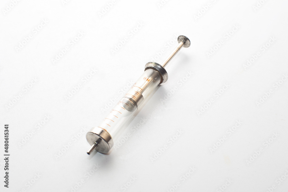 refillable glass syringe isolated on white background refillable glass syringe isolated on white background