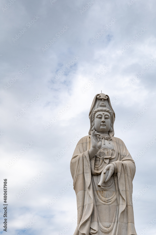Guanyin statue, the Chinese Goddess of Mercy and Compassion,  at the Kuang-Im Chapel, a new and unfinished Chinese-style Buddhist temple in Kanchanaburi, Thailand