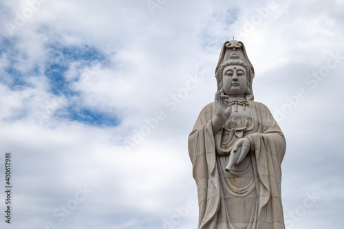 Guanyin statue, the Chinese Goddess of Mercy and Compassion, at the Kuang-Im Chapel, a new and unfinished Chinese-style Buddhist temple in Kanchanaburi, Thailand