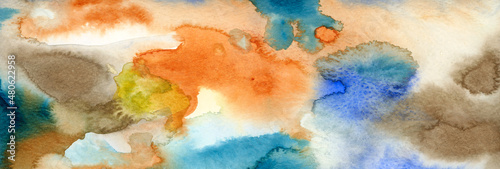 Banner border of abstract water color texture. Blue, orange and sepia toned color background. Hand drawing. Color splash on paper. Watercolor gradient. Creative modern banner. Colorful blotch and dap.