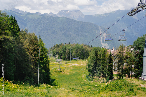 cable car with open trailers in the mountains. 