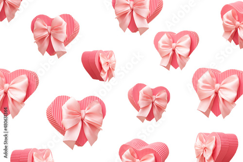 Pattern of flying pink heart shaped gift boxes isolated on white background