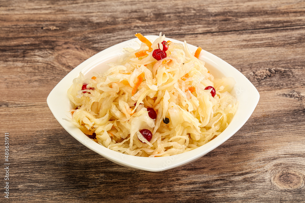 Sauerkraut with cranberry in the bowl Sauerkraut with cranberry in the bowl