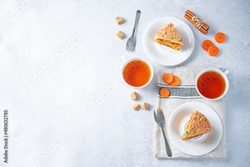Fototapeta Naklejka Na Ścianę i Meble -  Carrot cake with cream cheese filling in a plate