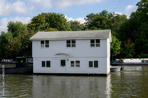 Houseboat is towed on River Thames