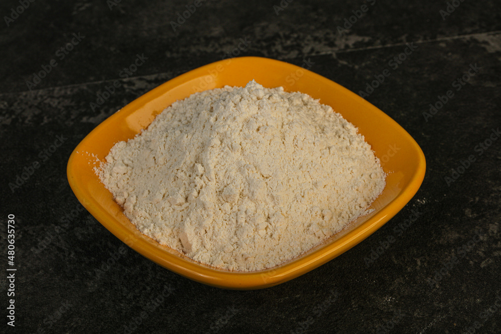 Wheat flour heap in the bowl Wheat flour heap in the bowl