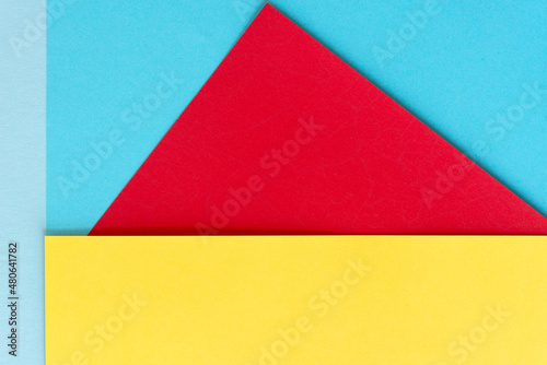 blue, red, and yellow paper background