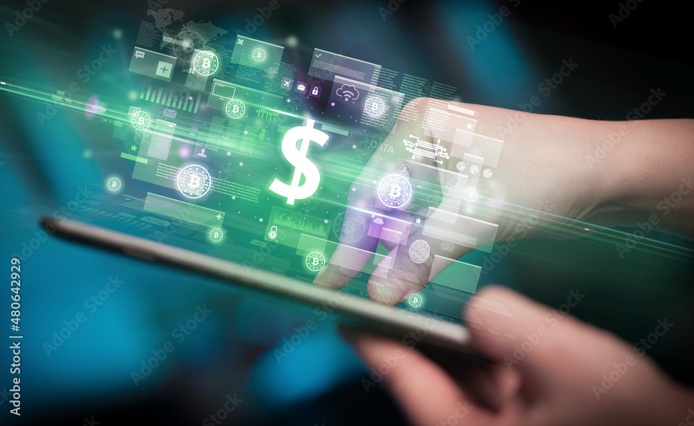 Close-up of a hand using tablet, currency concept Close-up of a hand using tablet, currency concept