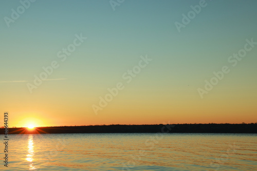 Picturesque view of beautiful sunset over calm river