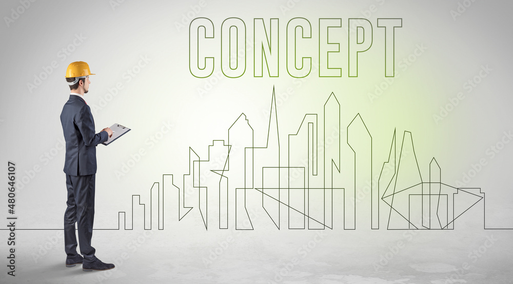Businessman in hard hat holding blueprint
