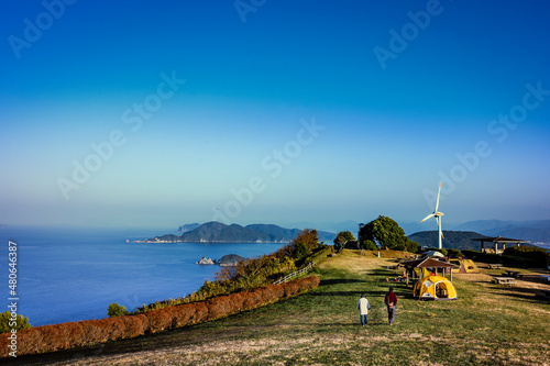 A couple enjoying a large panorama of Senjojiki at Yamaguchi, Japan photo