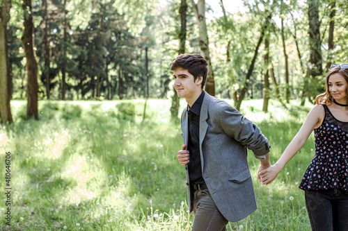 Happy couple on a walk in spring nature. The lifestyle of people of happiness.