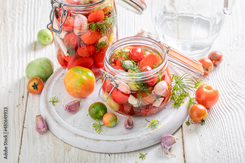 Healthy pickled tomatoes made of vegetables from greenhouse.