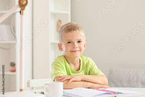 Adorable little boy sitting...